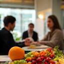 Group workshop discussion with healthy foods displayed